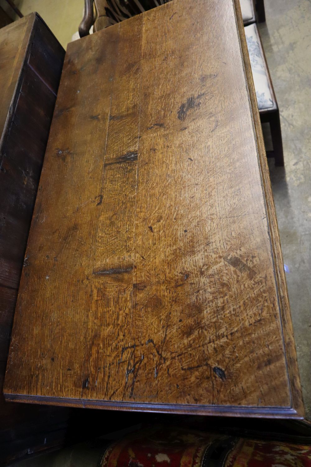 An 18th century oak chest fitted four graduated long drawers on shaped bracket feet, width 97cm depth 50cm height 96cm